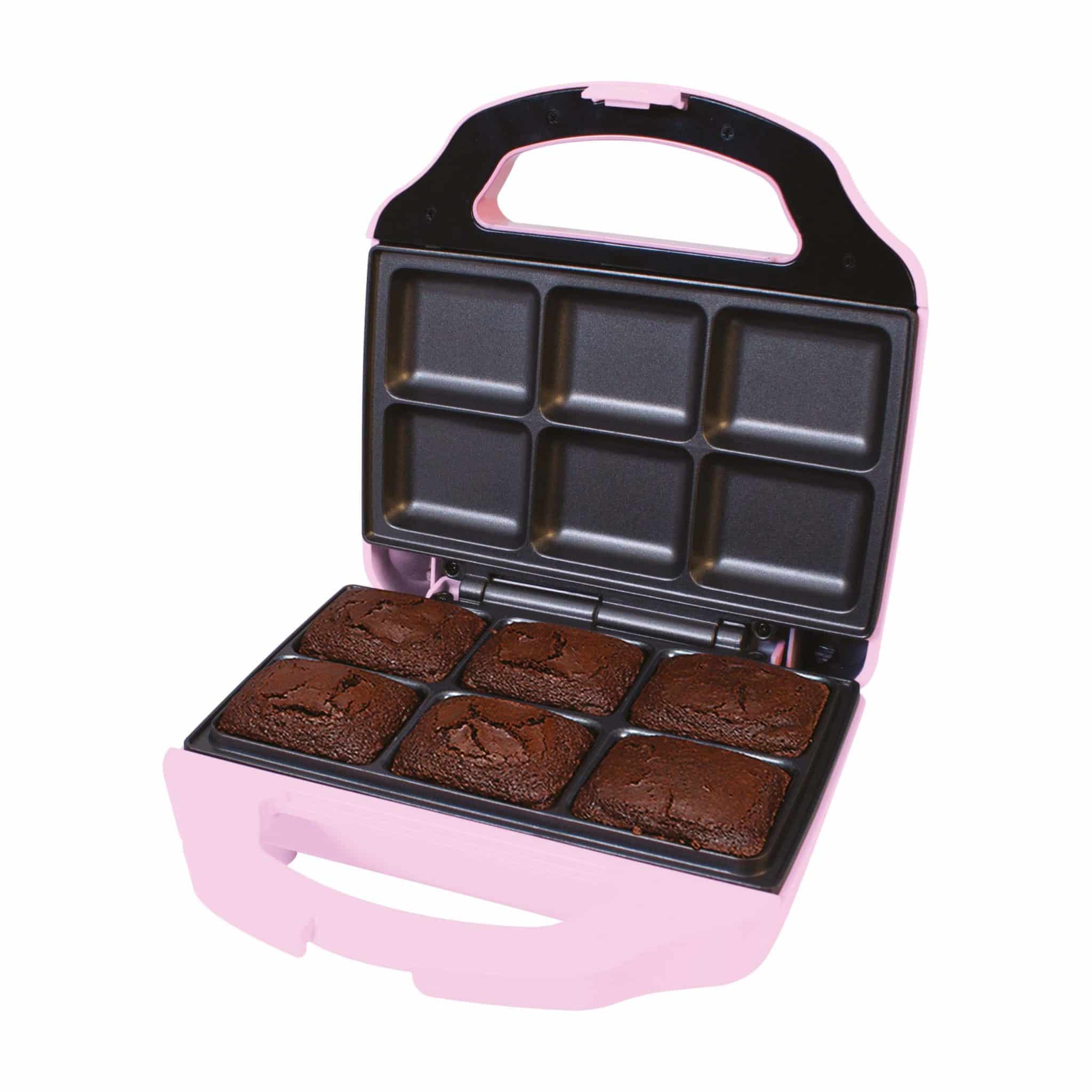 Mini brownie maker lid open containing brownies on white background