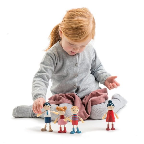 girl playing with wooden toys