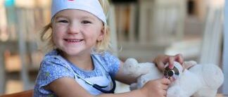 little girl playing as a nurse - Copy